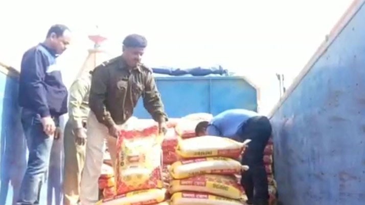 A lorry seized for allegedly smuggling counterfeit rice from a reputed company
